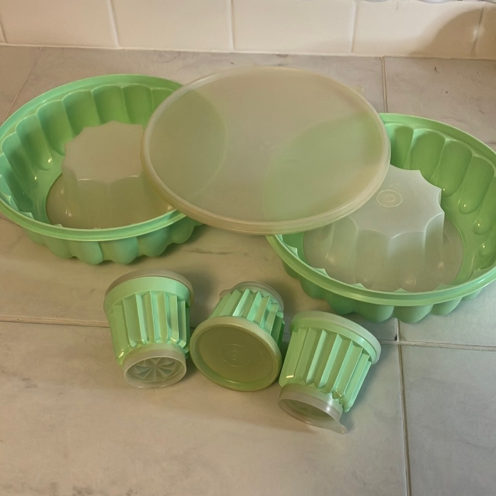 Tupperware 2 green molds / 1 lid. 3 small mold containers.